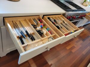 A drawer with many different types of tools in it.