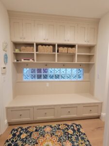 A room with a window and shelves in it