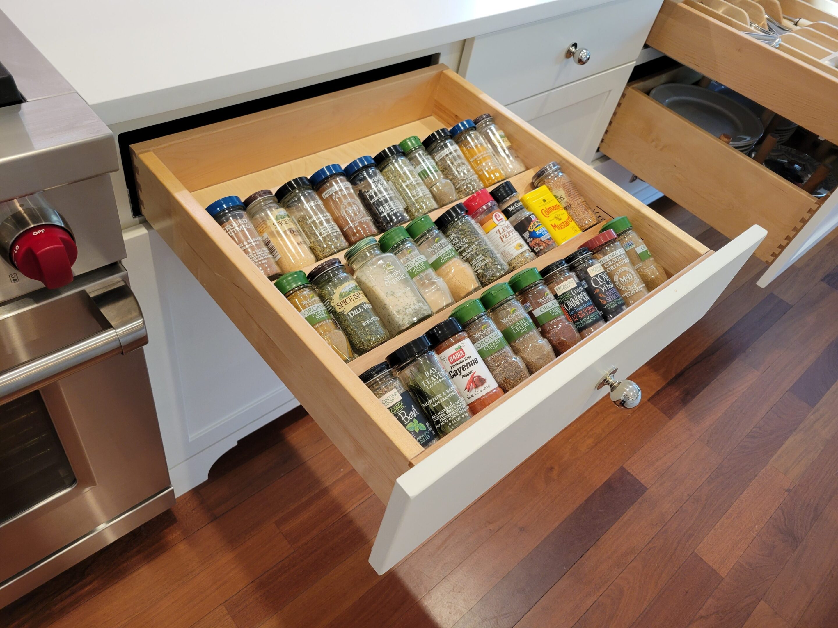 67ddf25d93d72_20230306_104324 A drawer with spices in it is organized.
