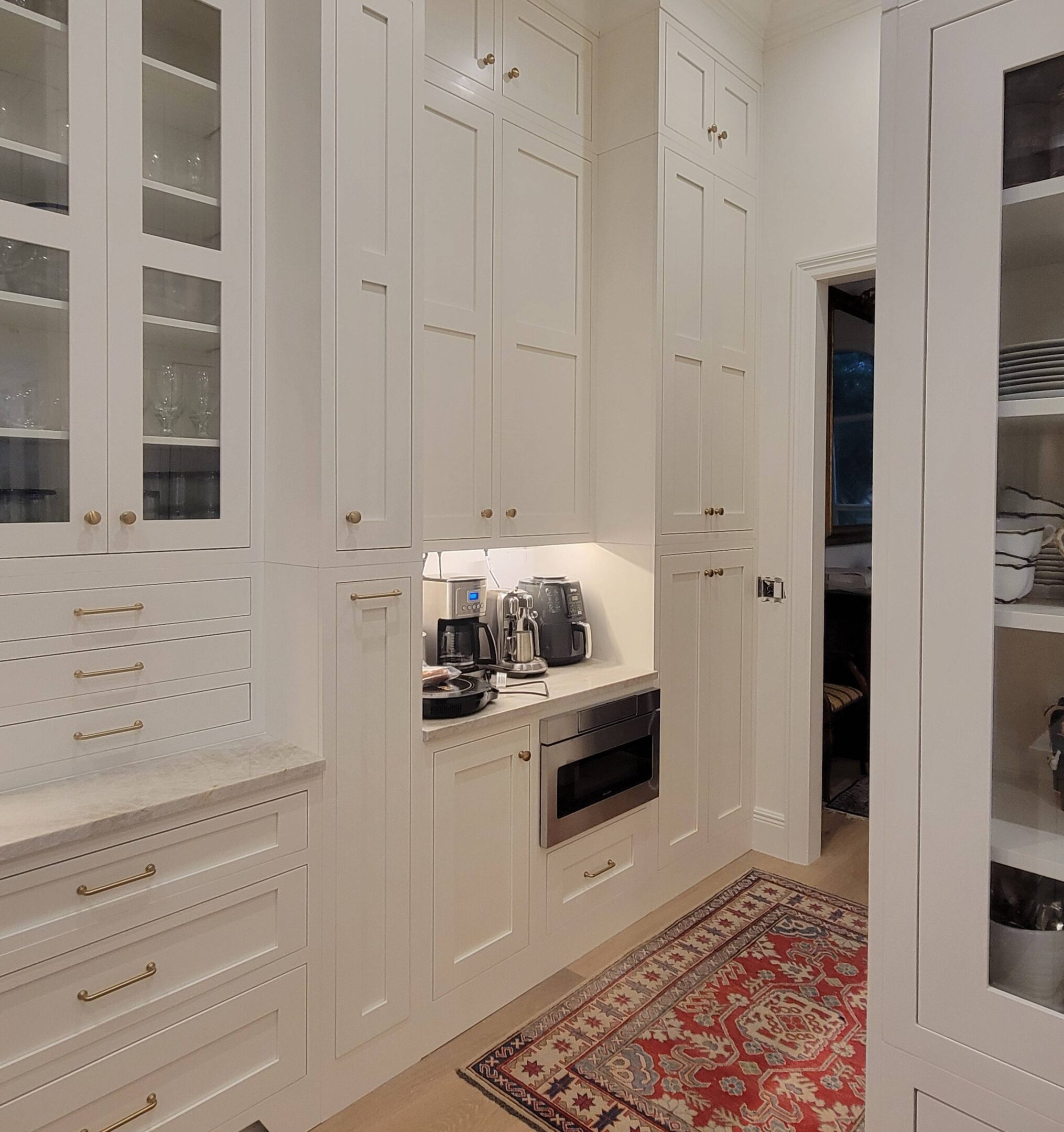 New Project (67) A white pantry with lots of cabinets and drawers.