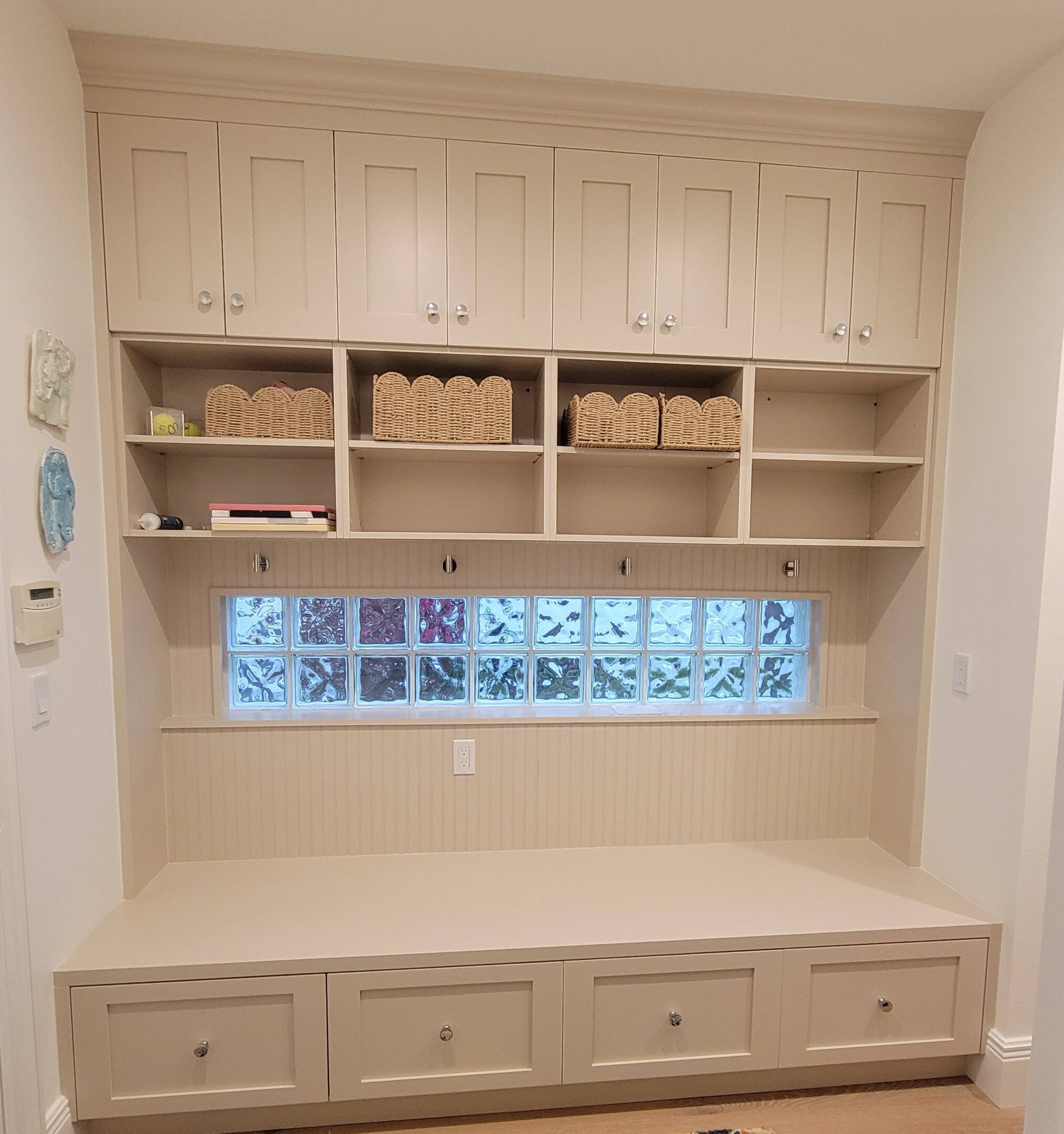A room with a window and shelves in it